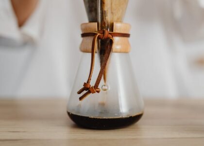 Close-up of a Chemex coffee maker with a reusable filter in use, highlighting sustainable brewing options for Chemex users.