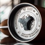 Detailed close-up image of Comandante coffee grinder emphasizing product craftsmanship.