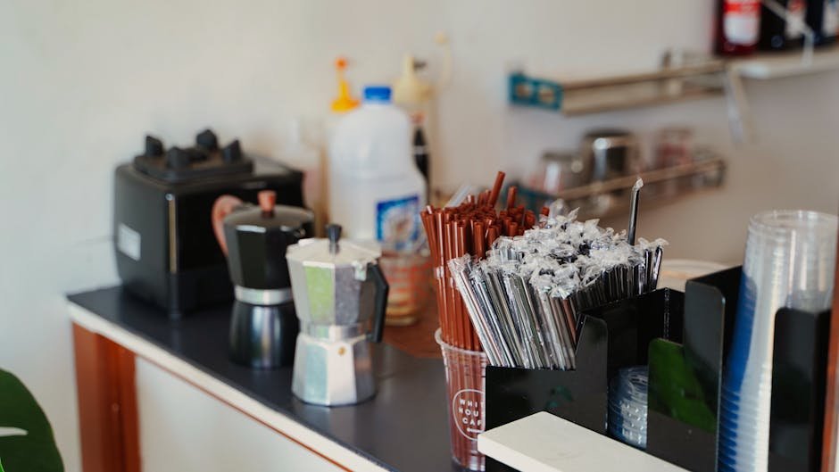 A moka pot and an electric coffee maker sit side by side on a kitchen counter, illustrating the difference between coffee maker and moka pot.