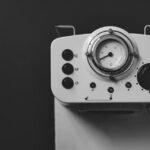 Espresso machine control panel with pressure gauge, illustrating steps for adjusting espresso machine pressure.