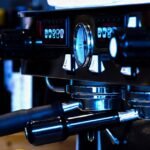Close-up of an espresso machine’s pressure gauge and controls, illustrating how pressure settings impact espresso brewing.