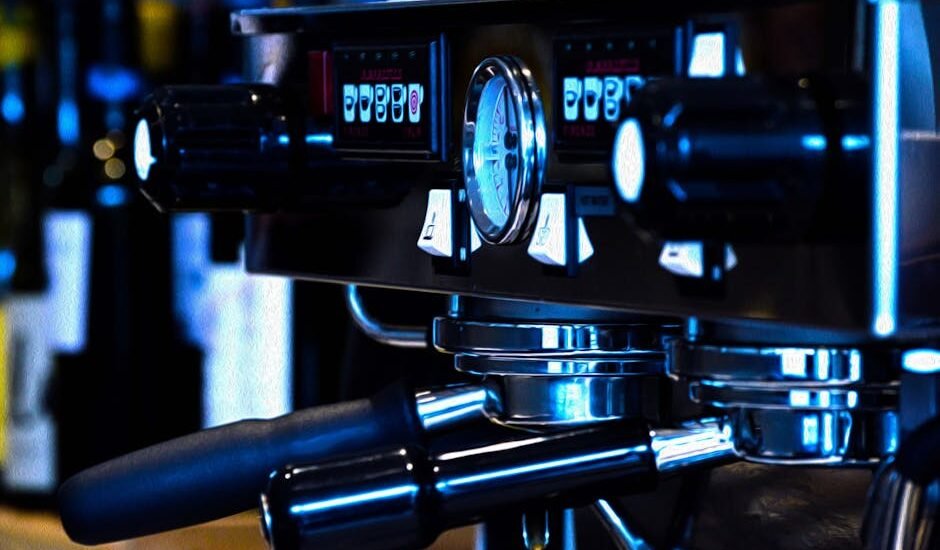 Close-up of an espresso machine’s pressure gauge and controls, illustrating how pressure settings impact espresso brewing.