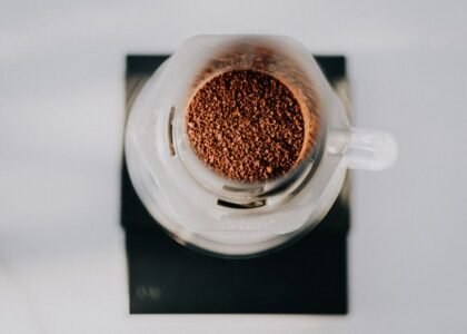 Ground coffee in an AeroPress, relevant to brewing methods discussed in the article.