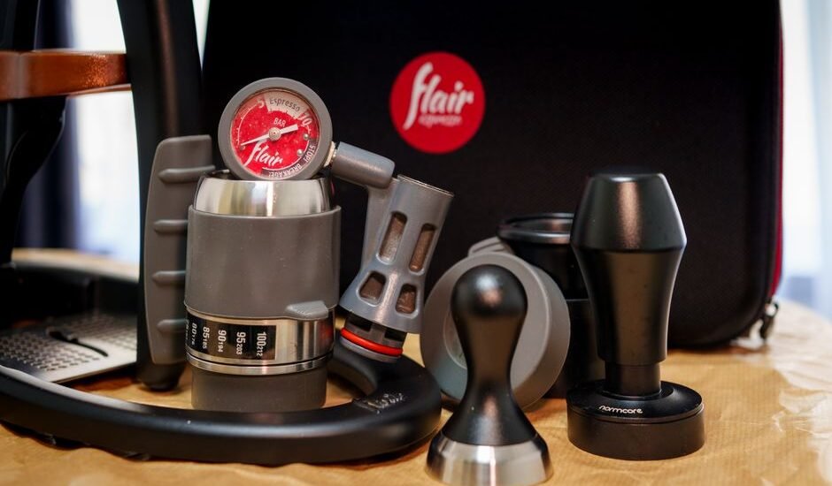 A collection of portable espresso maker parts, showcasing the article's focus on portable espresso makers.