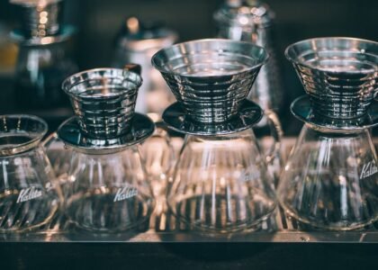 A setup showing pour-over coffee funnels and glass carafes, relevant to using a funnel for brewing.