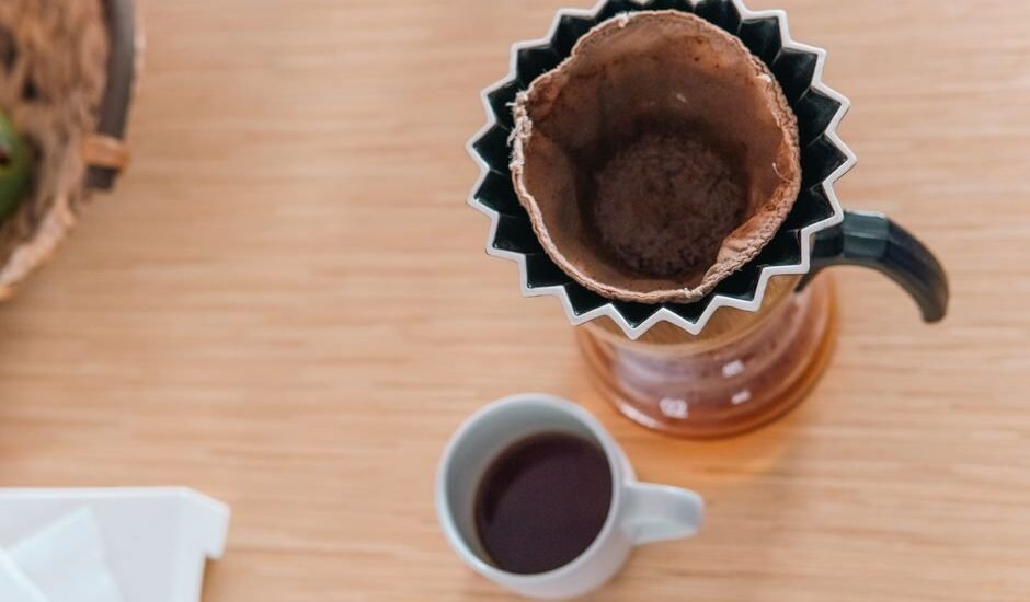 Coffee bloom process shown with a pour-over setup and brewed coffee below.