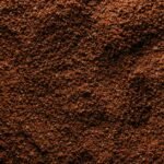 Detailed view of coffee grounds illustrating grind size distribution relevant to brewing.