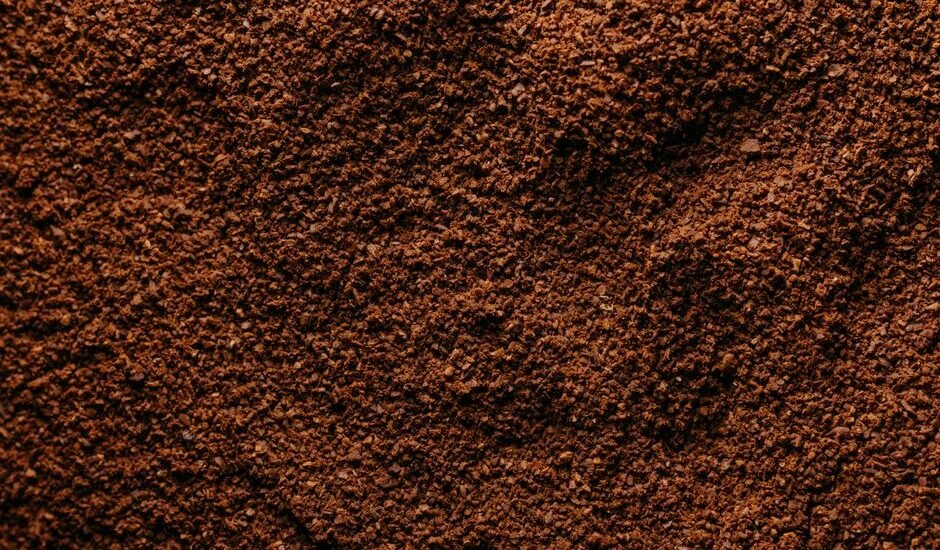 Detailed view of coffee grounds illustrating grind size distribution relevant to brewing.