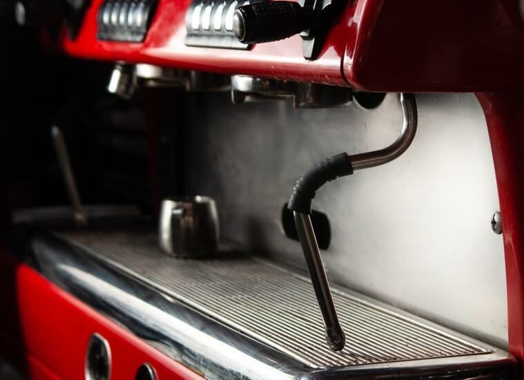 Close-up of an espresso machine showing the portafilter area, relevant for gasket replacement.