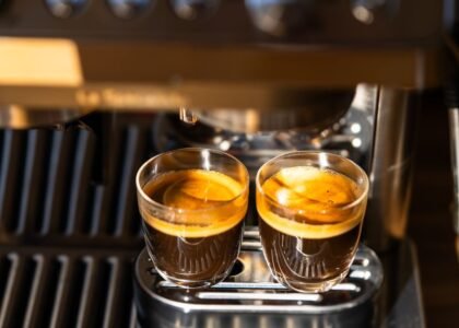 Two espresso shots in clear glasses, illustrating channeling in espresso extraction.