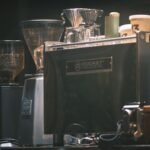 Espresso machine and grinders set up, illustrating when to start shot timer.