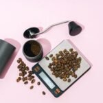 A coffee scale with whole beans and ground coffee, illustrating the cost of coffee scales.