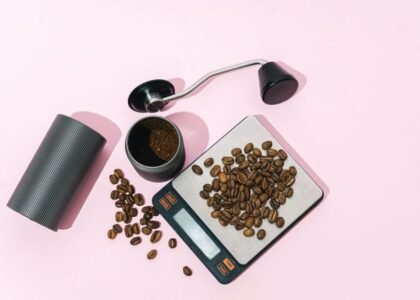 A coffee scale with whole beans and ground coffee, illustrating the cost of coffee scales.