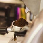 A portafilter basket filled with finely ground coffee, relevant to best portafilter baskets.