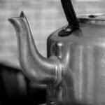 A kettle spout with visible limescale buildup, relevant to removing limescale.